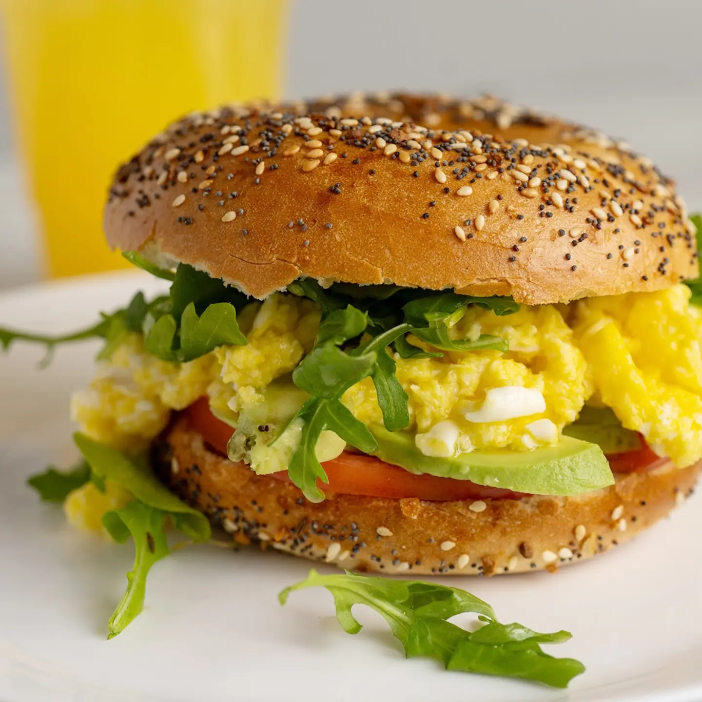 Truffle Lover Bagel , egg sandwhich with tomatoe, avacado, arugula, mozzarella chees and truffle oil on everything bagel, at Mamale Kosher Chalav Yisrael Cafe in Bay Harbor Islands